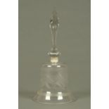 A Victorian clear glass bell, etched and with faceted handle. Height 32 cm.