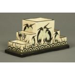 An Art Deco style flower brick, decorated with stylised penguins. Width 24 cm.