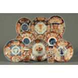 Ten pieces of 19th century Imari, plates, bowls and two vases.