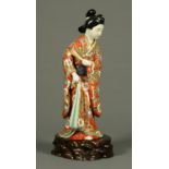 A Chinese porcelain figure, female holding fan, polychrome.
