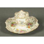 A Dresden porcelain inkwell with integral stand, foliate and gilt,