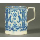 A Chinese blue and white tankard, with brown lip and with repeating foliate design. Height 14 cm.