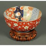 A 19th century Japanese Imari bowl, decorated in typical Imari colours,