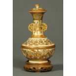 A small Japanese Meiji period vase, allover decorated with figures,