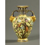 A 19th century Derby vase, two handled, with birds and branches. Height 15 cm.