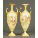 A pair of Orion China vases, in the Worcester style, decorated with roses. Height 46 cm.