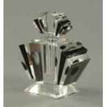 A large glass perfume bottle, black and clear glass with screw off lid. Width 20 cm, height 24 cm.