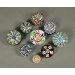 Nine Perthshire paperweights. Largest diameter 80 mm.