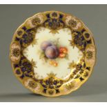 A Royal Worcester fruit plate, signed "Sebright". Diameter 23.5 cm.