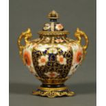 A Royal Crown Derby lidded urn, in Imari colours. Height 13 cm.