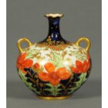 A Royal Crown Derby two handled urn, with tapered neck. Height 95 mm.
