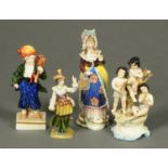 Four Continental porcelain figurines. Tallest 17.5 cm.