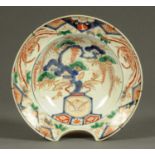 A late 18th/early 19th century Chinese barber's bowl, decorated in Imari colours.