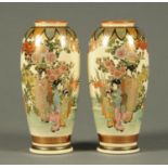 A pair of early 20th century Satsuma vases, decorated with figures and gilding. Height 22 cm.