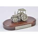 Scarce Pewter Ford 7810 Tractor mounted on a plinth. Marked Basildon Tractor Production. These
