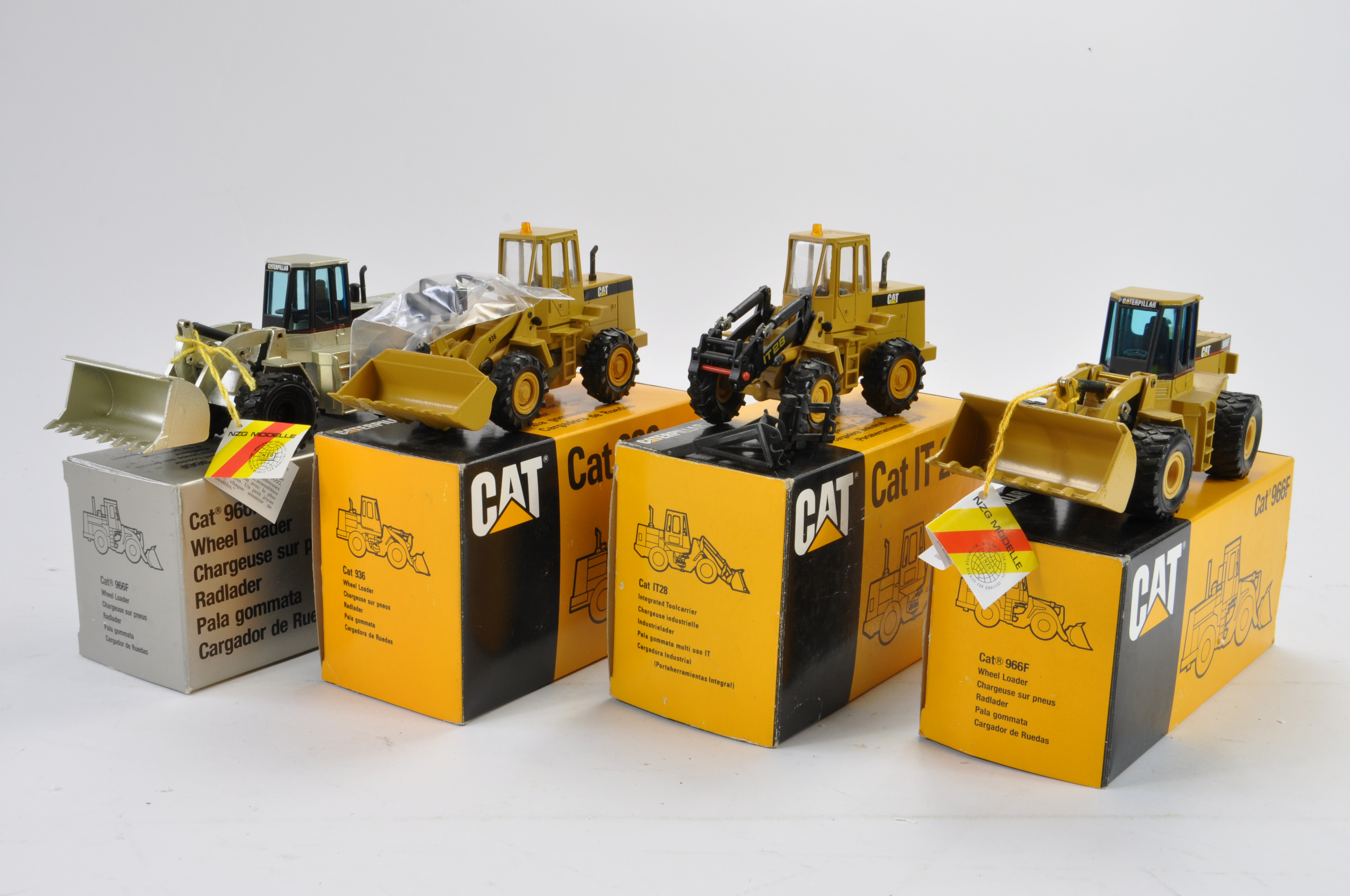Selection of NZG Wheel Loaders. CAT Themed. Generally NM to M in E Boxes. (4)