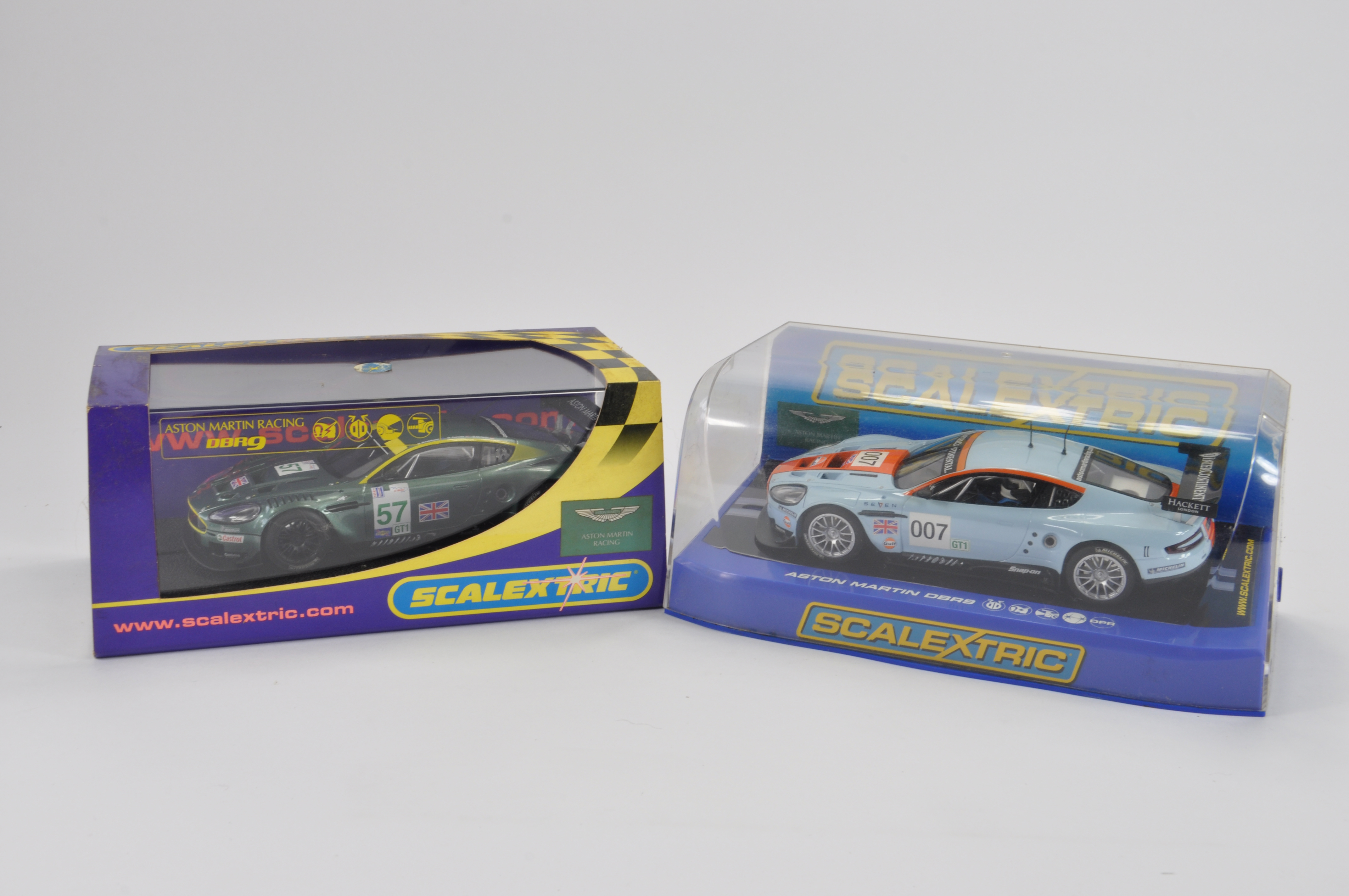 Pair of Scalextric Aston Martin issues. DBR9 Aston Martin Racing plus DBR9 Gulf Racing. Both NM to M