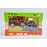 ROS 1/32 Scale Massey Ferguson 1014 Tractor and Implement Set. Mint in G (tear in cellophane) Box.