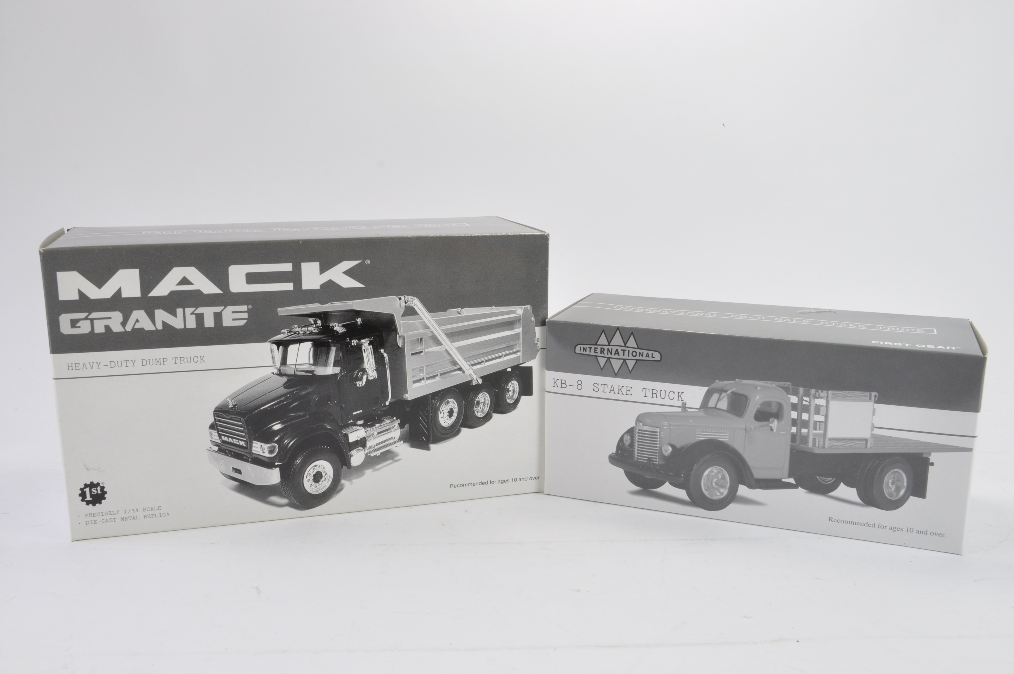 First Gear 1/34 scale Mack Granite Heavy Duty Dump Truck plus International Stake Truck. Both NM