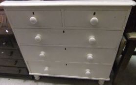 A painted pine chest of two short above three long drawers with turned knob handles,