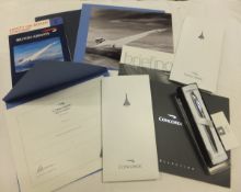 A collection of Concorde memorabilia, including cross pen luggage tags, photographs,