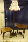 A Victorian two tier mahogany octagonal side table on ringed and turned supports to brown china