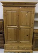 A pine two door wardrobe raised on a base of two short drawers CONDITION REPORTS Size 123 cm wide