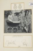 A framed and glazed black and white image of the Royal Family with infant Prince Edward in pram