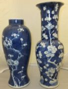 A Chinese porcelain blue and white vase decorated with prunus blossom and bearing six character mark