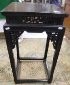 A Chinese dark stained square topped urn stand with stretchered base
