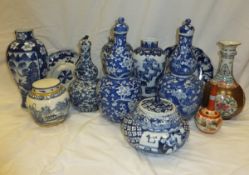 A collection of Chinese wares to include lidded urn, double gourd shaped lidded vases with prunus