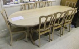 A modern limed oak dining room suite comprising D end refectory style dining table on end pillar