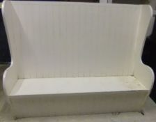 A white painted tavern style settle on plank end supports CONDITION REPORTS Various scratches,