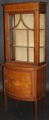 An Edwardian mahogany display cabinet, the upper section with single door,