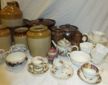 A collection of salt-glazed pots and storage jars,
