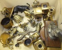 A box containing assorted metal wares to include brass animal fingers, a pair of candlesticks,
