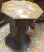 WITHDRAWN A Victorian rosewood and inlaid octagonal topped work table on pedestal to flat base