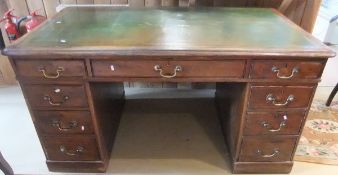 A Victorian oak partner's desk, the top with tooled and gilded leather insert,