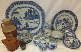 A 19th Century Chinese export blue and white platter decorated with pagodas in a landscape, together