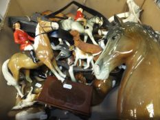 A box containing assorted horse ornaments,