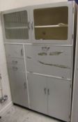 A 1950's kitchen light grey painted kitchen cabinet,