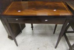 A modern mahogany and satinwood strung fold over card table of shallow bow fronted form,