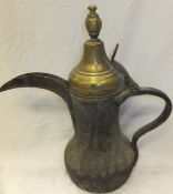 A Turkish brass coffee pot