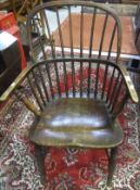 A 19th Century hoop back elbow chair with elm seat and turned H shaped stretcher,