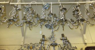 A collection of 13 matching modern chromed electroliers and 3 wall light fittings with clear