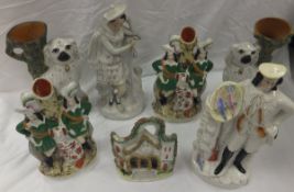 A collection of seven 19th Century Staffordshire figures to include vases, flatback figures,