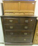 An early 20th Century teak hanging cabinet with two panels over three drawers,