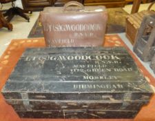 A black painted military trunk inscribed "Lt (S) G. Woodcock R.N.V.R. ....
