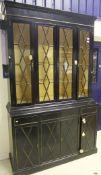 A 20th Century ebonised and gilt decorated bookcase cabinet in the George III manner