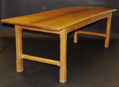A circa 1900 oak refectory style dining table, the plank top above a plain frieze on square